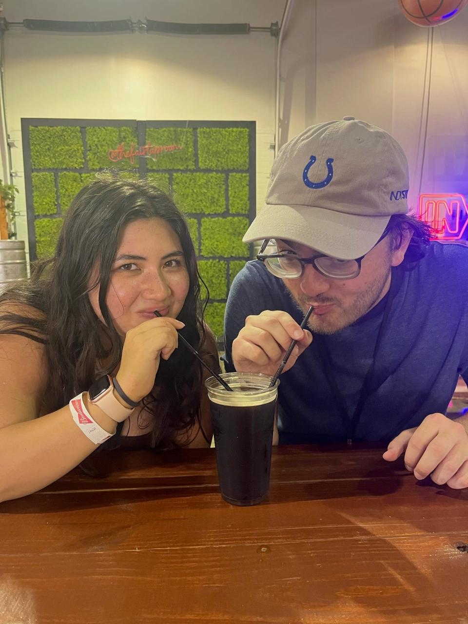 Pulliam interns Miranda Jeyaretnam and Nic Napier try the Sun King Cookie Ale in the Taproom at the Indiana State Fair.