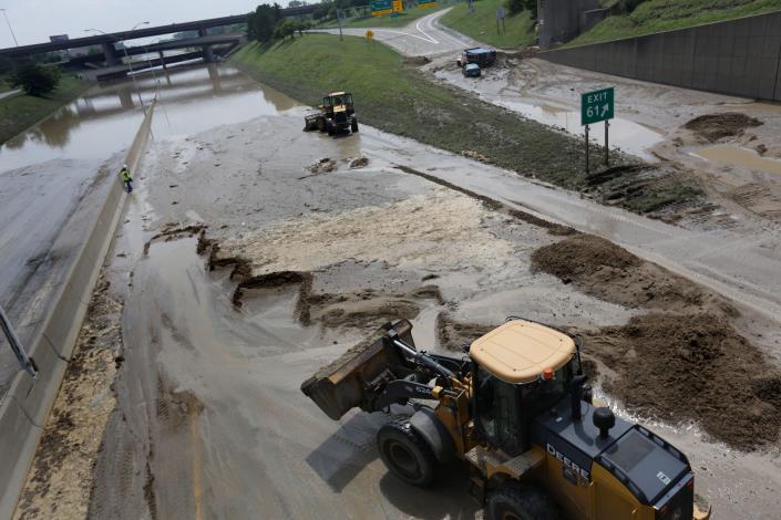 Crews clean up mud on I-75 at I-696 near Detroit on Tuesday August 12, 2014. The day was one of the rainiest in Michigan history, with 4.57 inches recorded at Detroit Metro Airport.