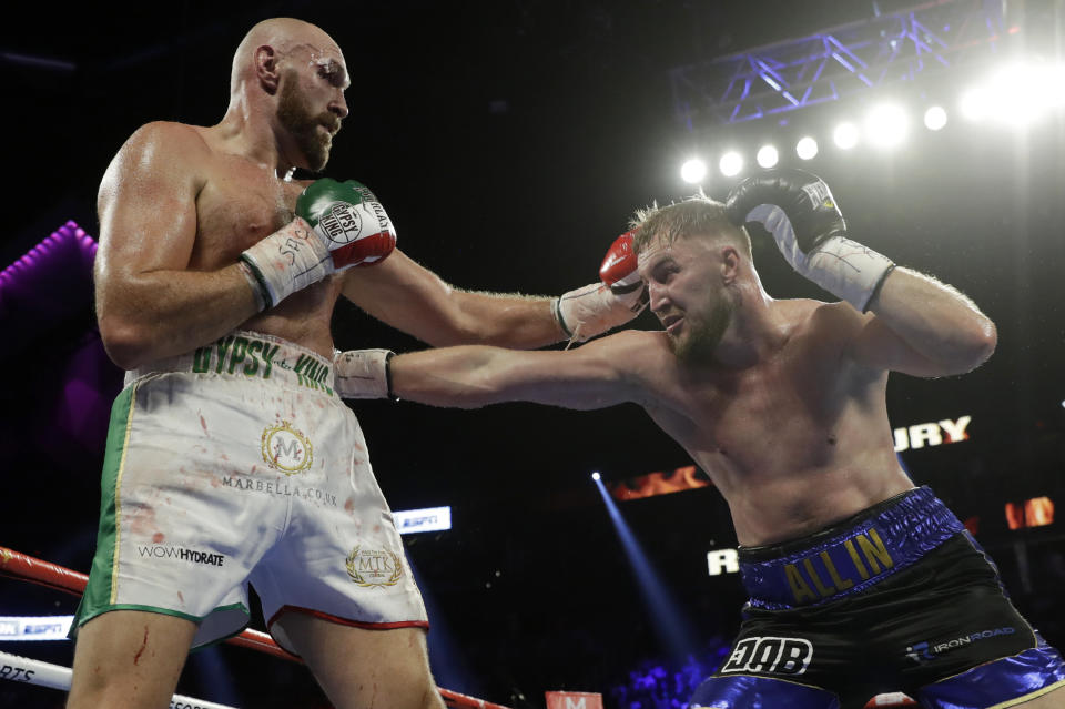 Otto Wallin, right, of Sweden, tries to hit Tyson Fury, of England, with a right during their heavyweight boxing match Saturday, Sept. 14, 2019, in Las Vegas. (AP Photo/Isaac Brekken)