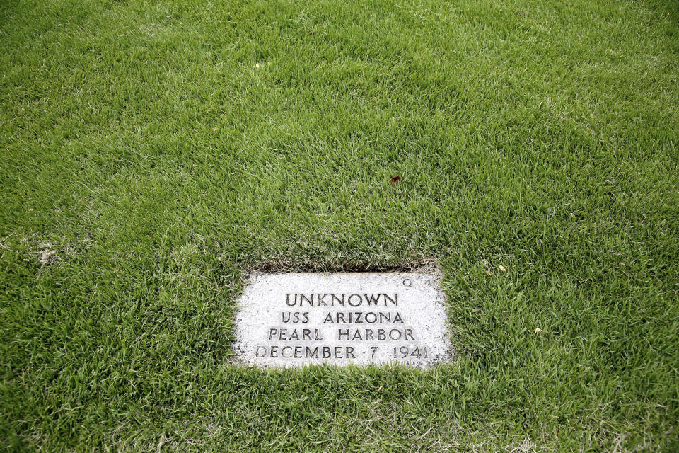 A grave marker for an unknown casualty from the USS Arizona is shown at the National Memorial Cemetery of the Pacific on Thursday, July 15, 2021 in Honolulu. Advances in DNA technology have allowed the U.S. military to exhume and identify the remains of hundreds of sailors and Marines buried as unknowns from the bombing of Pearl Harbor, decades after the 1941 attack that launched the U.S. into World War II. But the Defense POW/MIA Accounting Agency, which is responsible for locating and identifying missing servicemen and women, says it won't be able to do the same for those from the battleship that lost the most men that day: the USS Arizona. (AP Photo/Caleb Jones)