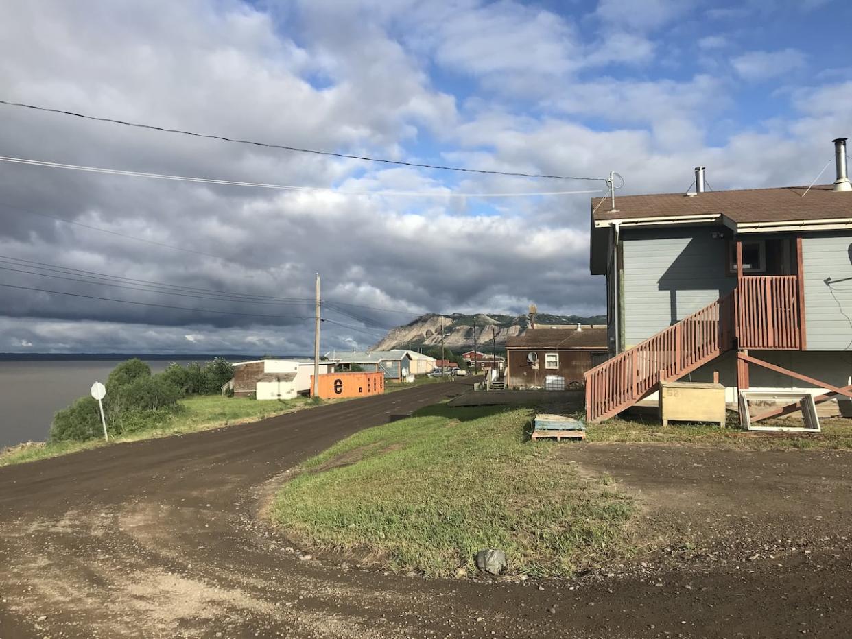 Tulita, N.W.T. in 2021. The community has been promised a new duplex that was set to arrive in the community by barge this summer. It's now expected to come by winter road in 2025. (Anna Desmarais/CBC - image credit)