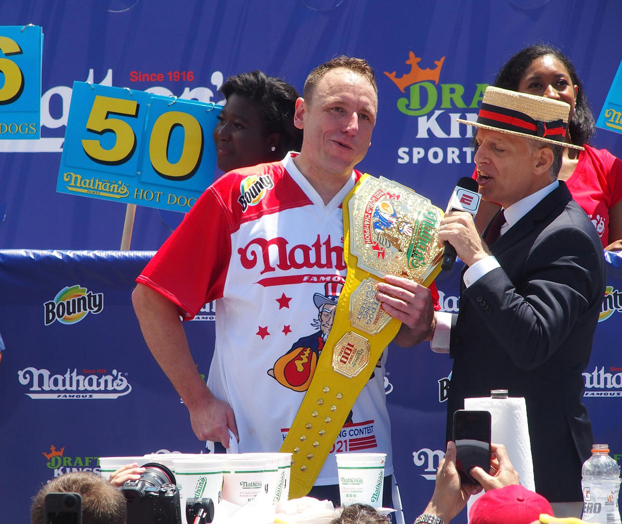 NEW YORK, NY - JULY 04:  Defending Champion Joey Chestnut wins after consuming 76 hot dogs and setting a new world record at the 2021 Nathan's Famous International Hot Dog Eating Contest at Coney Island on July 4, 2021 in New York City.  (Photo by Bobby Bank/WireImage)