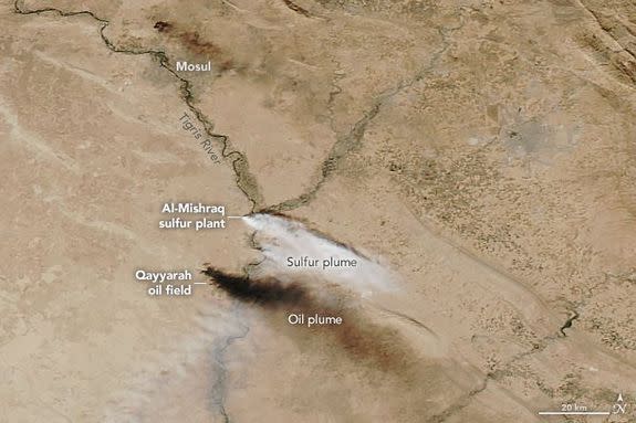 NASA satellite images show the two toxic smoke plumes near Mosul, Iraq, Oct. 24, 2016.