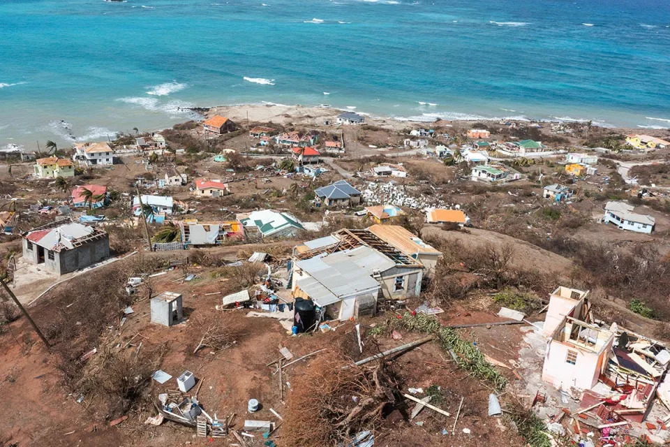 Scattered debris and houses with missing roofs are seen in a drone photograph after Hurricane Beryl passed the island of Petite Martinique, Grenada on July 2, 2024.