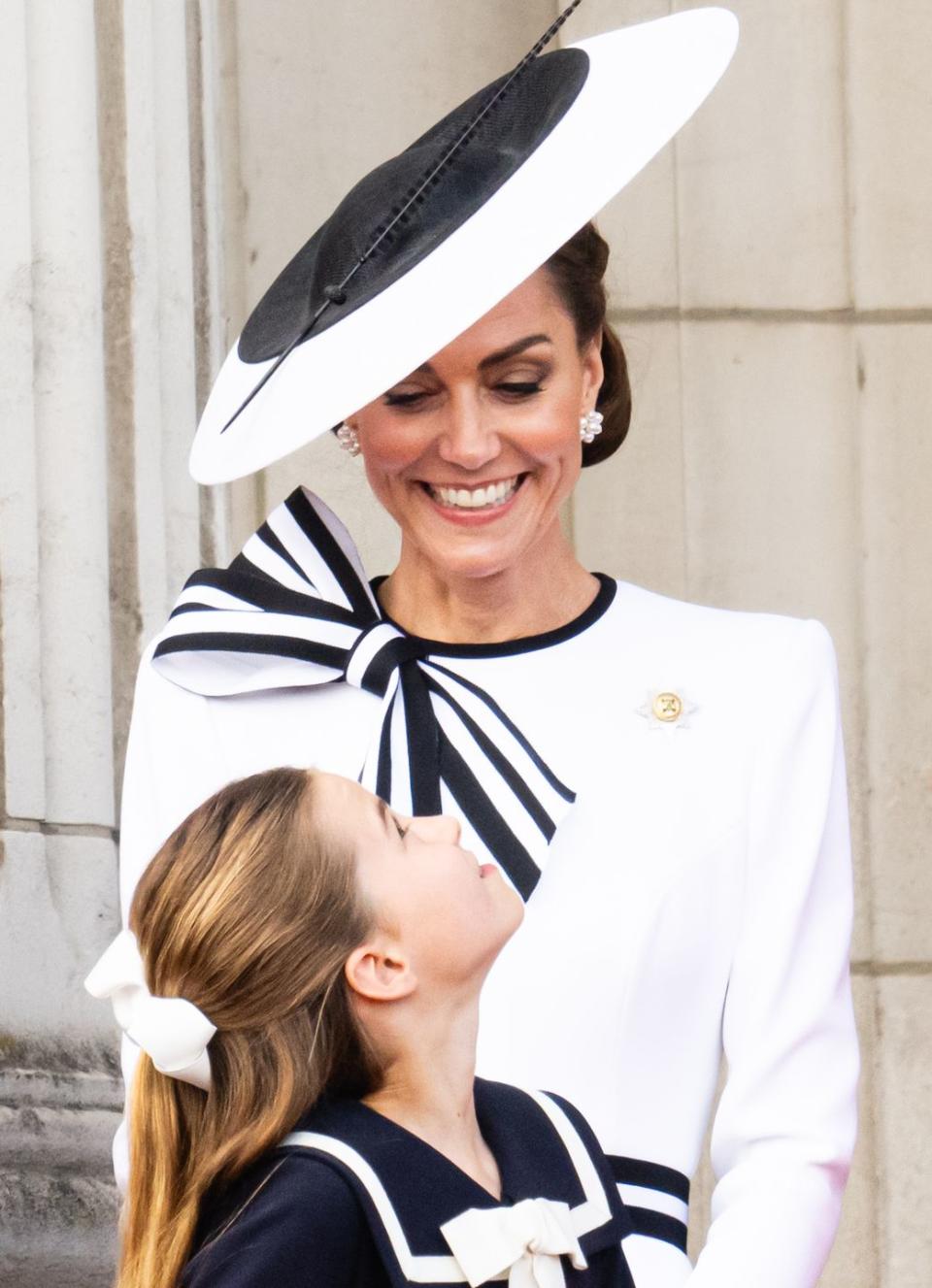 london, england june 15 catherine, princess of wales and princess charlotte of wales during trooping the colour on june 15, 2024 in london, england trooping the colour is a ceremonial parade celebrating the official birthday of the british monarch the event features over 1,400 soldiers and officers, accompanied by 200 horses more than 400 musicians from ten different bands and corps of drums march and perform in perfect harmony photo by samir husseinwireimage