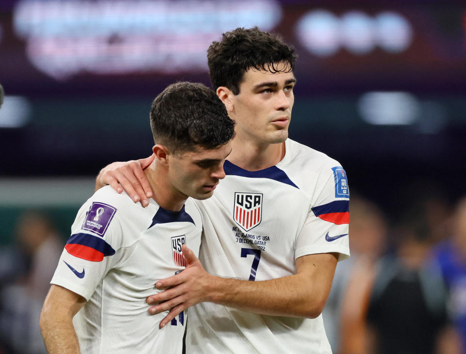 Soccer Football - FIFA World Cup Qatar 2022 - Round of 16 - Netherlands v United States - Khalifa International Stadium, Doha, Qatar - December 3, 2022 Christian Pulisic and Giovanni Reyna of the U.S. after the match as the United States are eliminated from the World Cup REUTERS/Wolfgang Rattay