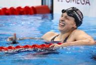Katie Ledecky reacts after winning and setting a new world record. REUTERS/Marcos Brindicci
