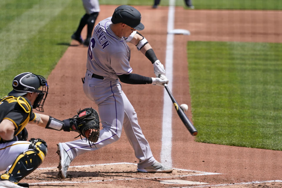 Colorado Rockies' Brian Serven singles off Pittsburgh Pirates relief pitcher Zach Thompson, driving in a run, during the second inning of a baseball game in Pittsburgh, Wednesday, May 25, 2022. (AP Photo/Gene J. Puskar)