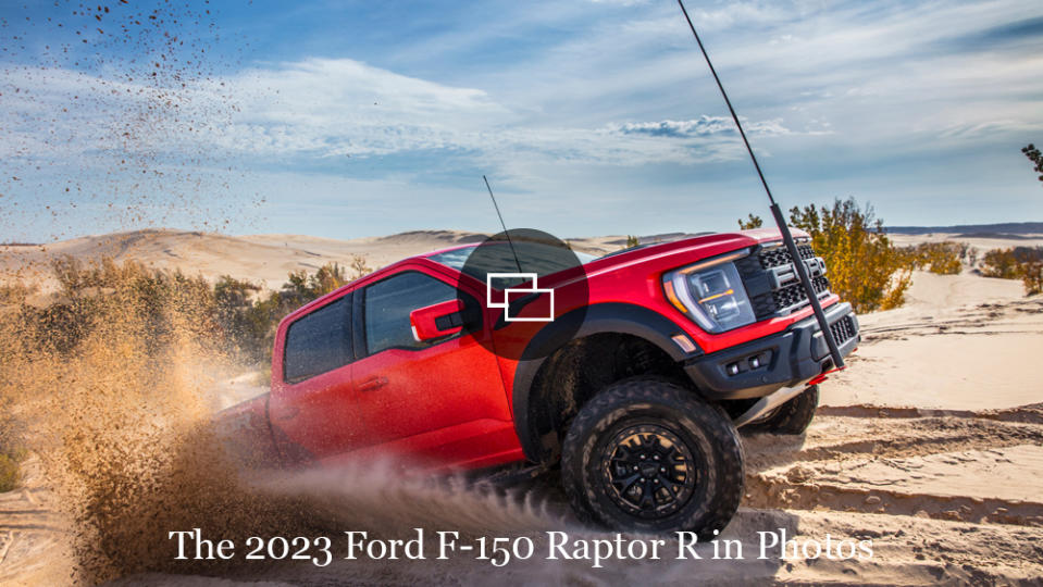 The 2023 Ford F-150 Raptor R driving up a sand dune.