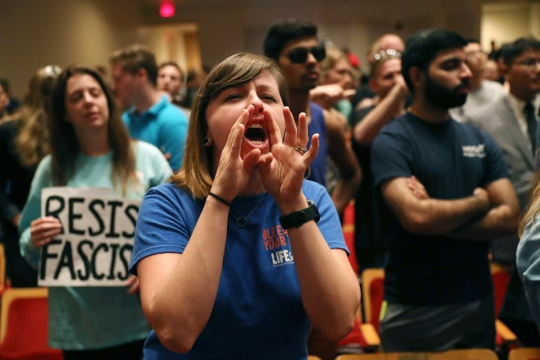 People react as white supremacist Richard Spencer, who popularized the term "alt-right," attempts to speak in Gainesville, Florida on October 19, 2017