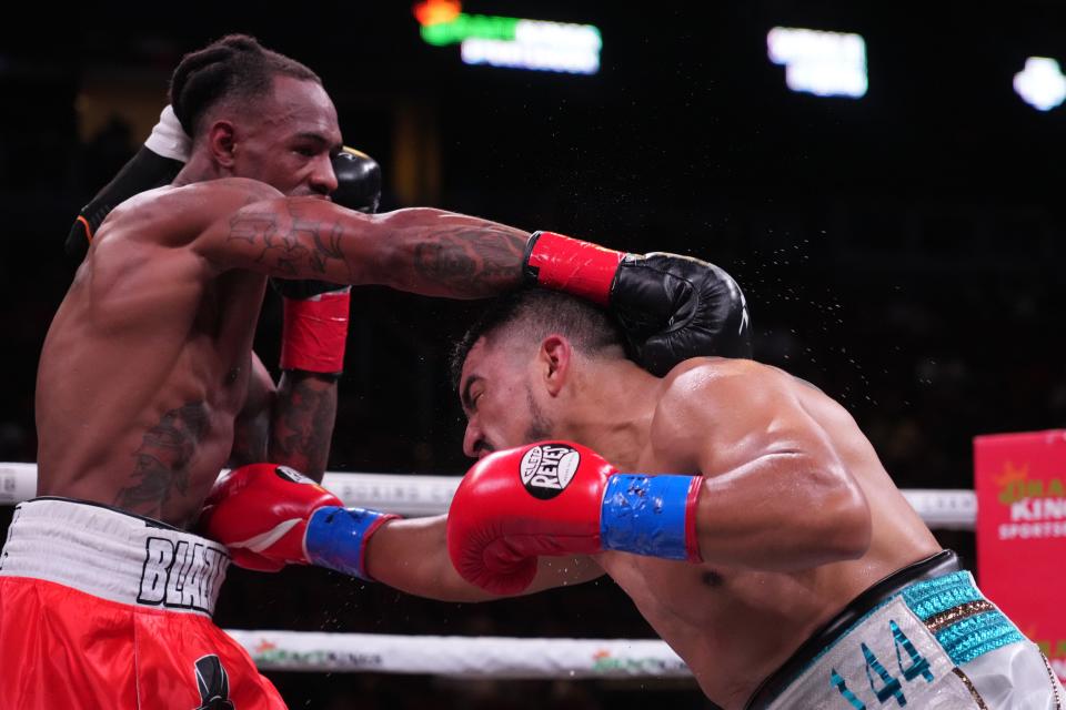 Victor Ortiz (white trunks) and Todd Manuel (red trunks) box during their super welterweight boxing match during a Premier Boxing Champions card at Gila River Arena.