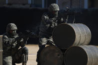 South Korean marines take position during their regular drill on Yeonpyeong Island, South Korea Thursday, Nov. 1, 2018. The U.S. and South Korea are reviewing whether they will conduct large-scale military exercises next year and will decide before December. South Korean Defense Minister Jeong Kyeong-doo told reporters Wednesday at the Pentagon that if more exercises are suspended the two countries will conduct other training to mitigate the lapse. He says the review will be done by Nov. 15. (Jeon Heon-kyun/Pool Photo via AP)