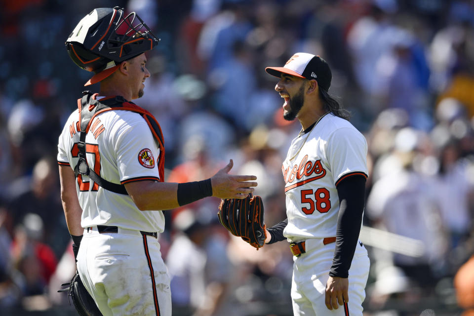 Baltimore Orioles relief pitcher Cionel Perez (58) celebrates with catcher James McCann, left, after a baseball game against the New York Yankees, Thursday, May 2, 2024, in Baltimore. The Orioles won 7-2. (AP Photo/Nick Wass)