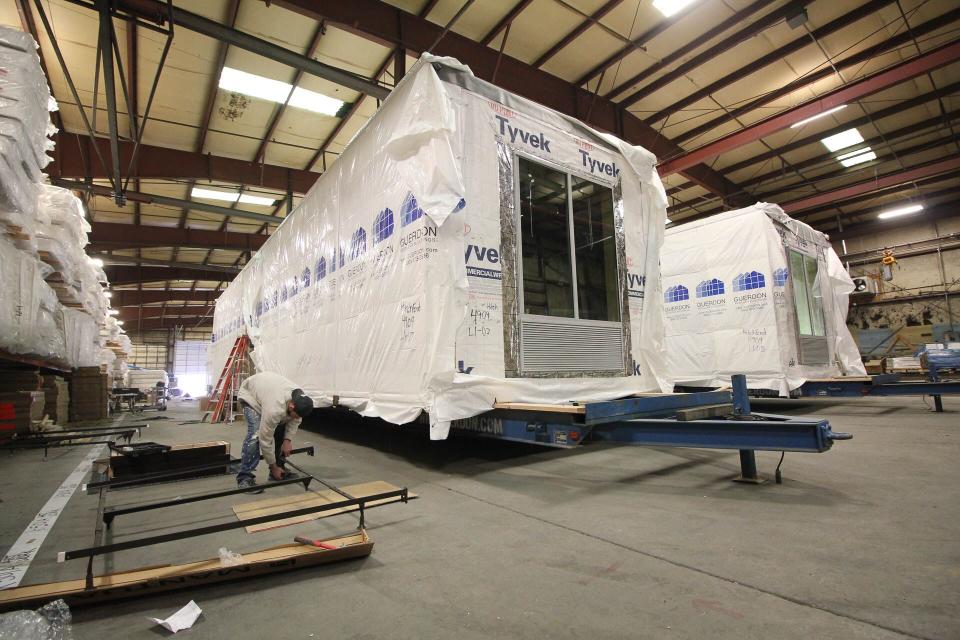 Built section-by-section in a factory, hotel units are shipped to a site and stacked, sometimes practically overnight. Photo credit: Guerdon Modular Buildings.