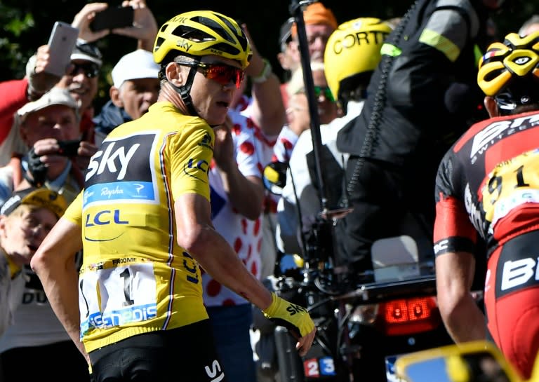 Chris Froome runs to get another bike after falling during the Tour de France 12th stage between Montpellier and Chalet-Reynard