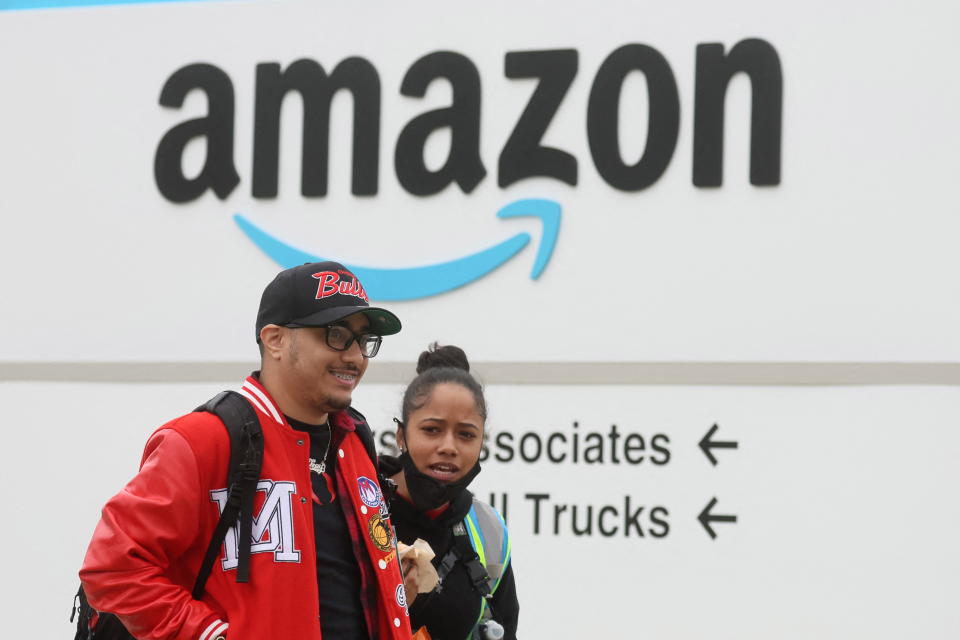 Amazon workers walk outside Amazon’s LDJ5 sortation center in New York City. (Credit: Brendan McDermid, REUTERS).