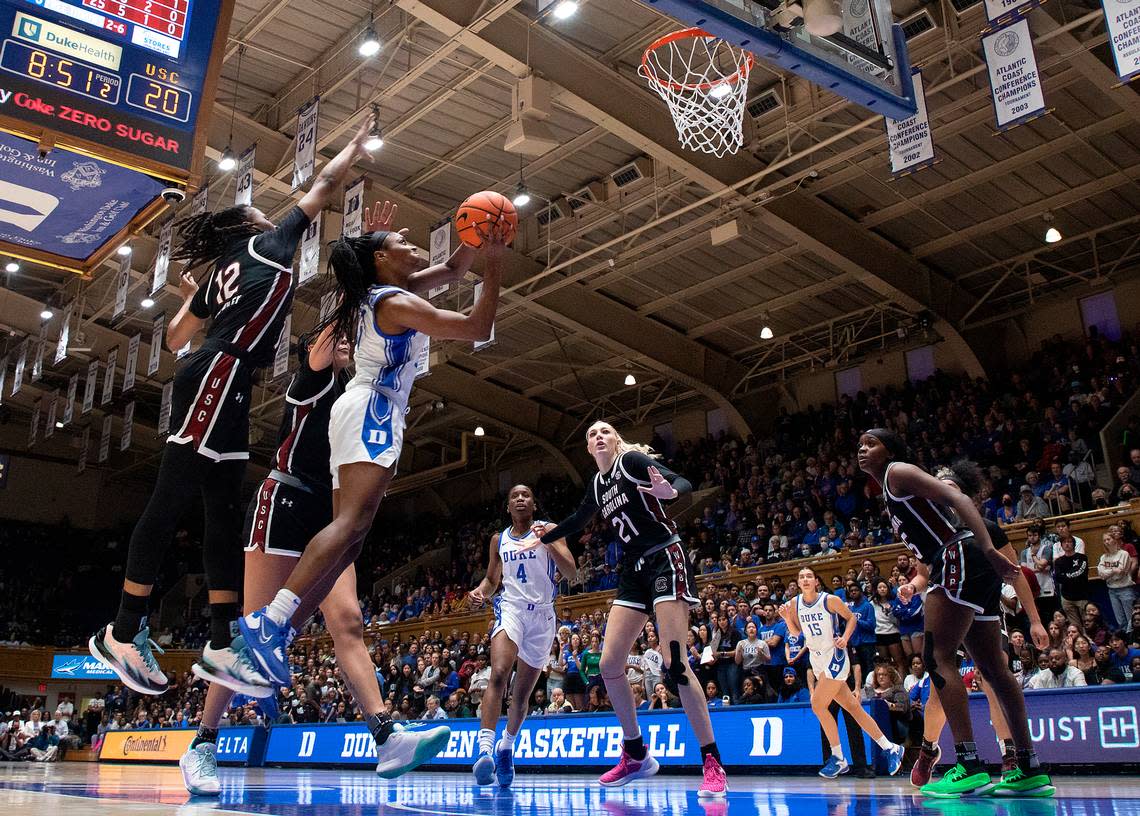 Duke’s Oluchi Okananwa drives to the basket past South Carolina’s MiLaysia Fulwiley and Kamilla Cardoso during the first half of the Blue Devils’ 77-61 loss on Sunday, Dec. 3, 2023, at Cameron Indoor Stadium in Durham, N.C. Kaitlin McKeown/kmckeown@newsobserver.com