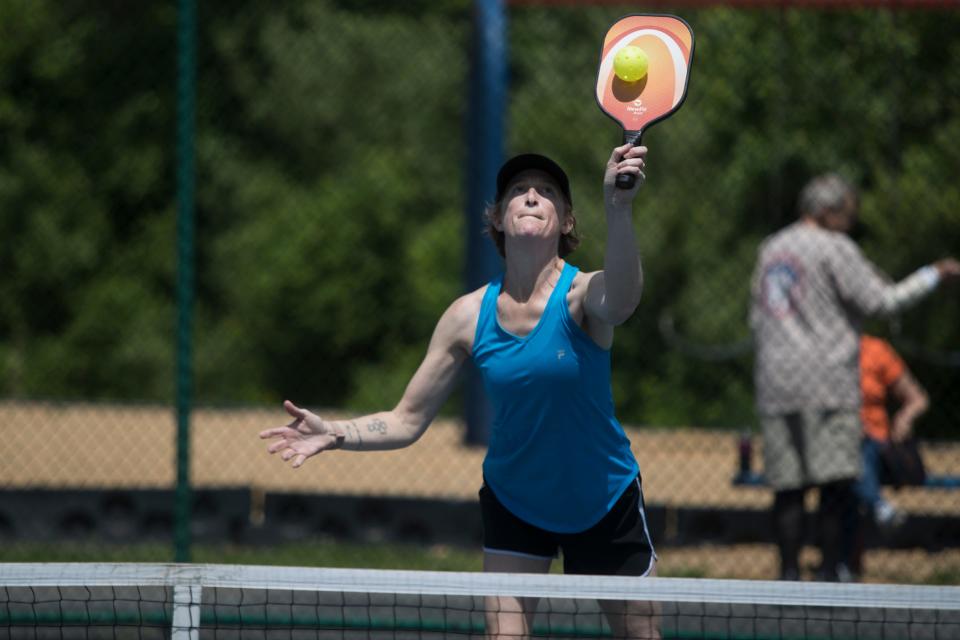 People play pickleball at Deacons Walk Park on Tuesday, May 17, 2022.