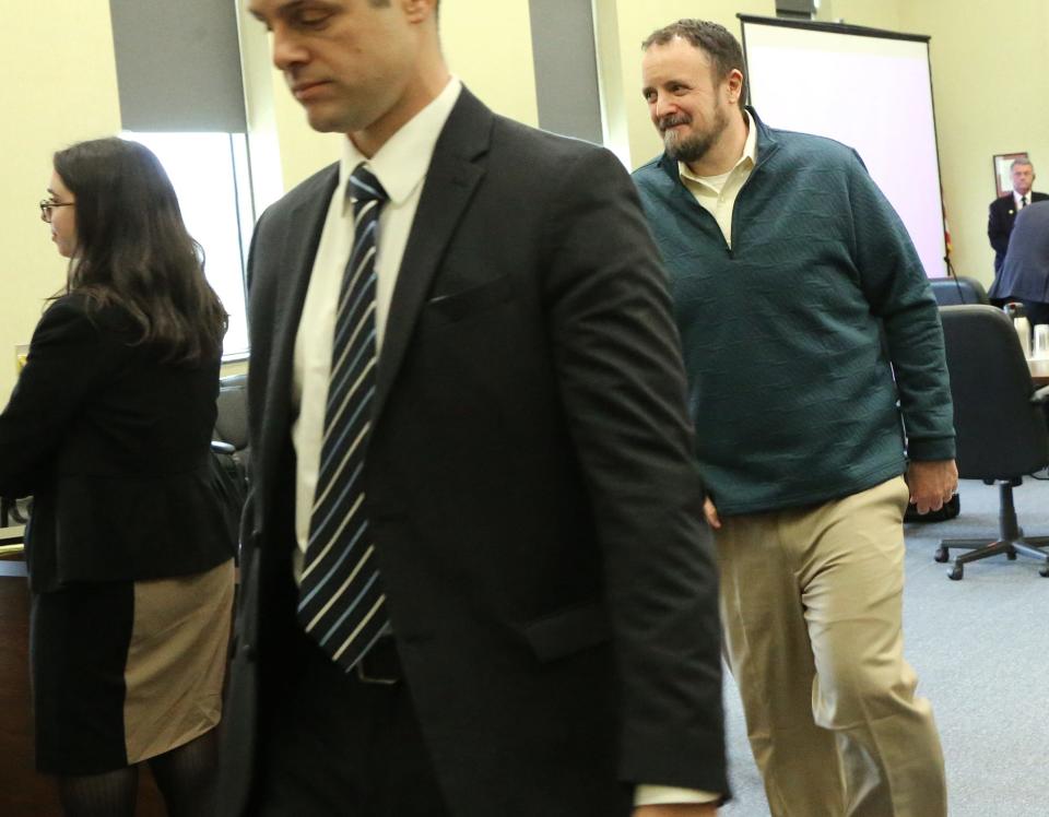 Timmothy Verrill smiles Friday, March 29, 2024 as he looks in the direction of his father, Richard, who is in the courtroom every day for his son's double murder trial in Strafford County Superior Court in Dover.