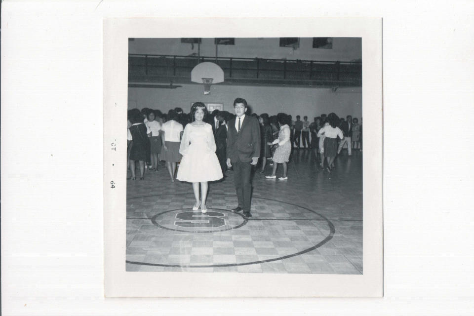 This October 1964 picture provided by the Stewart Indian School Cultural Center and Museum shows the Stewart Indian School dance at the old gym in Carson City, Nev. The state of Nevada plans to fully cooperate with federal efforts to investigate the history of Native American boarding schools. On Friday, Dec. 3, 2021, Gov. Steve Sisolak apologized for the state's role in funding the construction of and relocating Native children to the Stewart Indian School in Carson City from 1890 to 1980. As part of a government policy designed to assimilate them into Euro-American culture, children sent to residential schools were forcibly ripped from their homes, prohibited from speaking their languages and buried secretly on school grounds, historians say. The Stewart School is among more than 350 that the Interior Department plans to investigate in a review announced this year. (Courtesy of Stewart Indian School Cultural Center and Museum via AP)