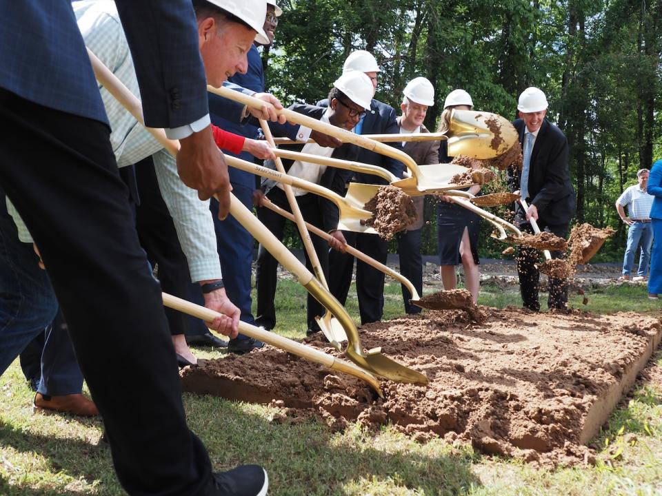  Central Arkansas leaders don helmets and shovels on May 14, 2024 to break ground on Pulaski County’s future homelessness village, Providence Park. (Mary Hennigan/Arkansas Advocate)