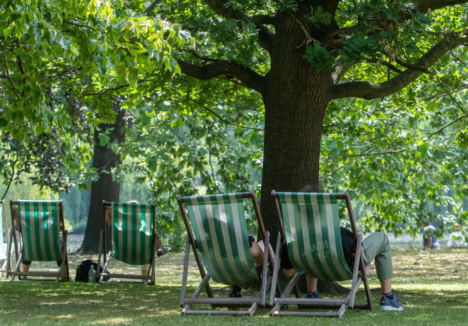 People relax in deckchairs at St James's Park in central London. The Met Office has issued guidance that most of the UK will meet heatwave criteria next week, and an amber alert for hot weather for hot weather has been issued by the UK Health Security Agency (UKHSA). Picture date: Sunday June 11, 2023. (Photo by Jeff Moore/PA Images via Getty Images)