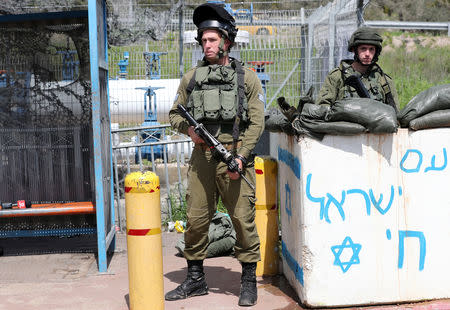 Israeli forces stand guard near the scene of Palestinian shooting attack near the Jewish settlement of Ariel, in the occupied West Bank March 17, 2019. REUTERS/Ammar Awad