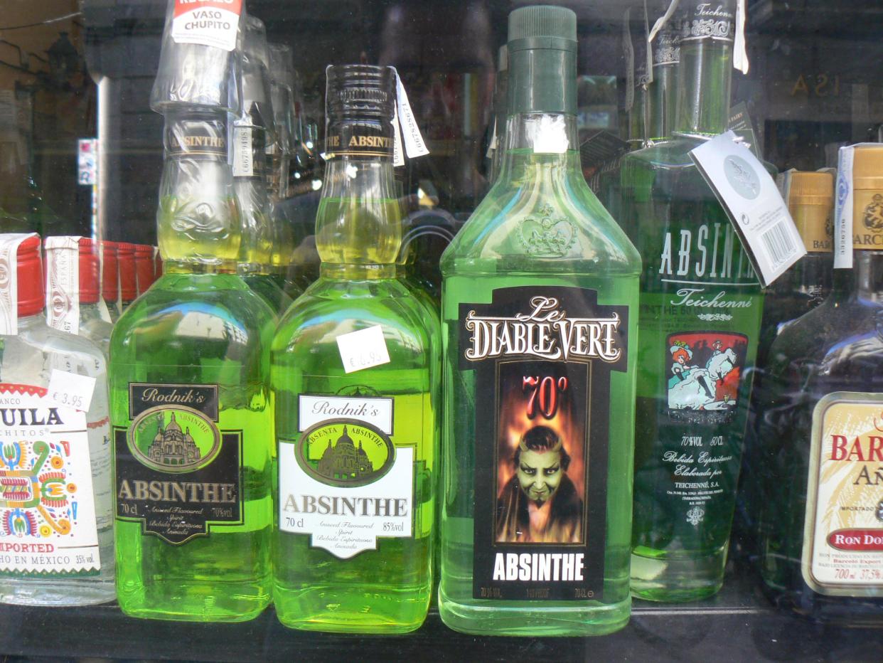 Absinthe bottles lined up on bar