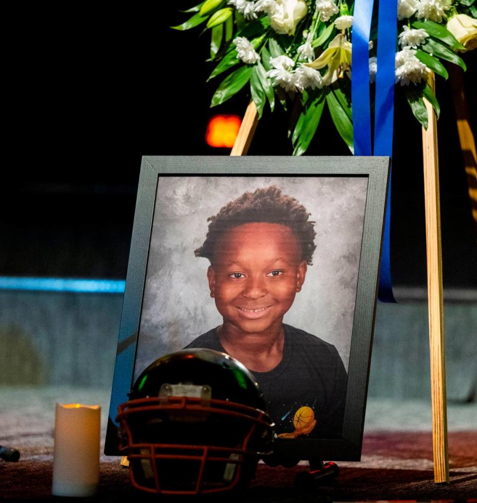 A photo of Keith “KJ” Frierson is displayed with his Jr. Mustangs football helmet at his funeral service at Liberty Towers Church in Foothill Farms on Saturday. Lezlie Sterling/lsterling@sacbee.com