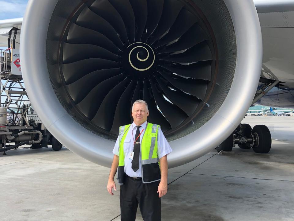Retired captain Mark Stevens in front of Delta A350 engine.