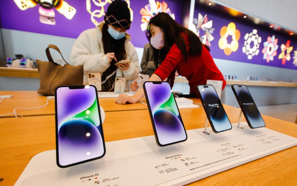 People look at i-Phone 14 models at an Apple store at a mall in Beijing, China, 07 November 2022 - WU HAO/EPA-EFE/Shutterstock