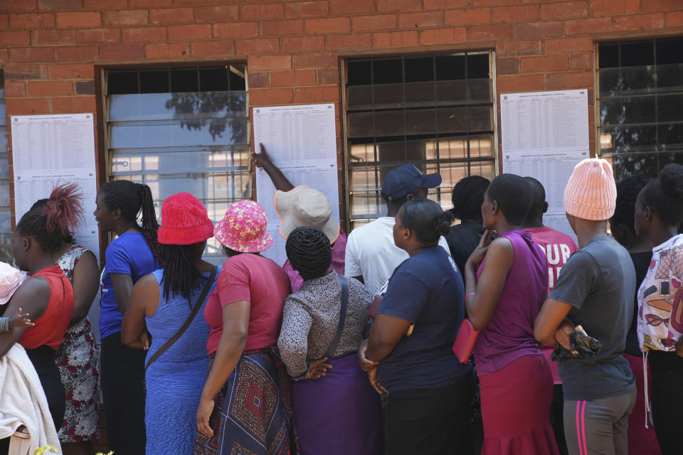 Voters queue to cast their votes, at a polling station in Harare, Wednesday, Aug. 23 2023. Polls have opened in Zimbabwe as President President Emmerson Mnangagwa seeks a second and final term in a country with a history of violent and disputed votes. (AP Photo/Tsvangirayi Mukwazhi)