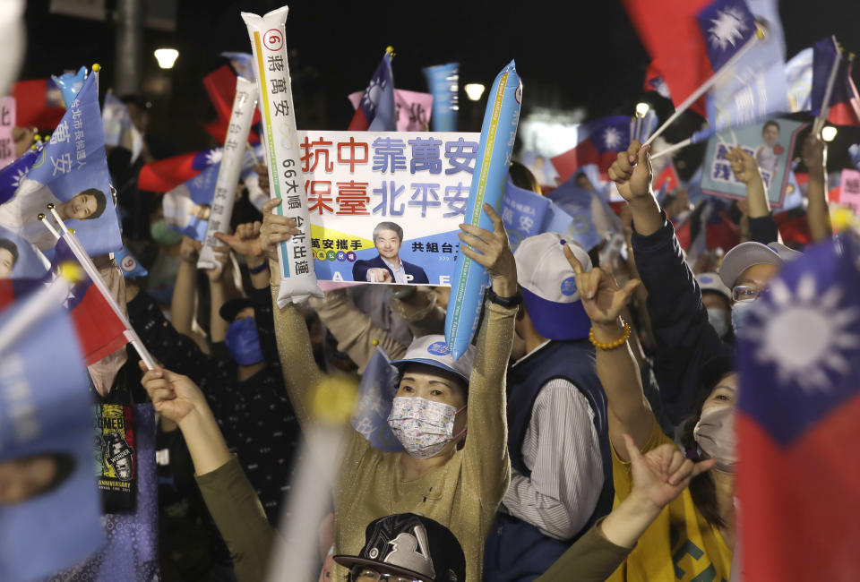 Supporters of Taiwan Kuomintang party Taipei city mayoral candidate Wayne Chiang cheer in Taipei, Taiwan, Saturday, Nov. 26, 2022. Lingering concerns about the threat posed by its giant neighbor China took a backseat in Taiwan''s closely watched local elections on Saturday as voters focused on other pressing issues closer to home such as air pollution and bad traffic. (AP Photo/Chiang Ying-ying)