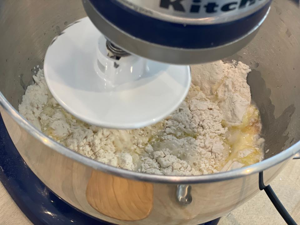 electric mixer combining dough ingredients