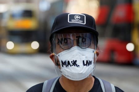 Masked anti-government protesters gather in Hong Kong