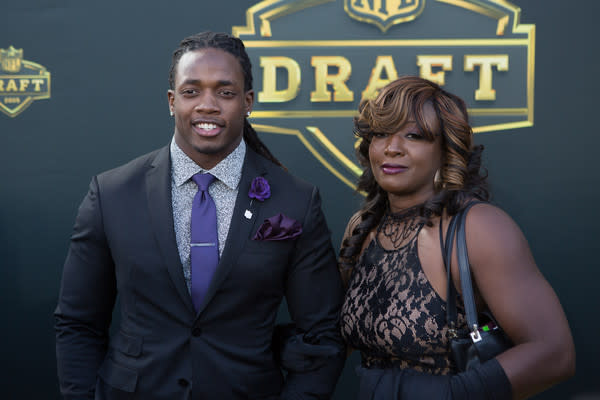 Melvin Gordon from the Wisconsin Badgers and his mom Carmen arrive on the gold carpet for the first round of the 2015 NFL Draft at the Auditorium Theatre of Roosevelt University on April 30, 2015 in Chicago, Illinois. (April 29, 2015 - Source: Kena Krutsinger/Getty Images North America)