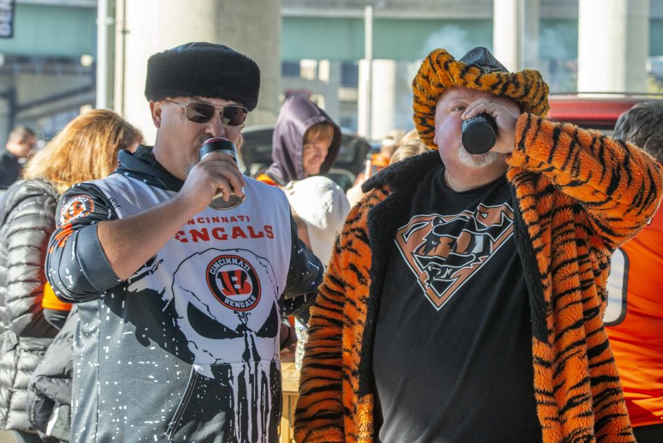 Thousands of Cincinnati Bengals and Cleveland Browns Fans turned out for tailgating parties around Paul Brown Stadium for the Battle of Ohio on Nov. 7, 2021. John Ryan and Fish enjoy a cold beer.
