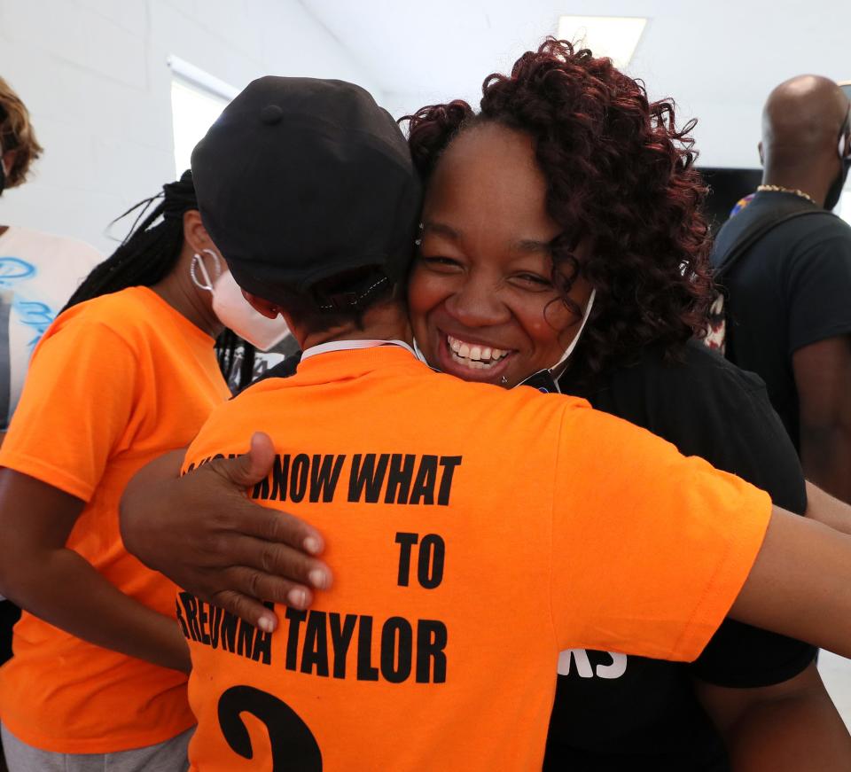 Tamika Palmer, mother of Breonna Taylor, who was killed by police, gets a hug from actress Jada Pinkett Smith before the start of a rally on the steps of the Kentucky State Capitol on Thursday, June 25, 2020.