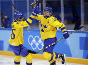 <p>Pernilla Winberg (16) celebrates with Hanna Olsson (26), of Sweden, after scoring a goal against the combined Koreas during the second period of the preliminary round of the women’s hockey game at the 2018 Winter Olympics in Gangneung, South Korea, Monday, Feb. 12, 2018. (AP Photo/Julio Cortez) </p>