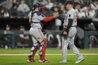 Minnesota Twins catcher Christian Vázquez, left, and closing pitcher Caleb Thielbar celebrate their team's 3-2 win over the Chicago White Sox during the ninth inning of a baseball game Monday, April 29, 2024, in Chicago. (AP Photo/Erin Hooley)