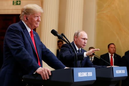 Russia's President Vladimir Putin gestures during a joint news conference with U.S. President Donald Trump after their meeting in Helsinki, Finland, July 16, 2018. REUTERS/Kevin Lamarque/Files