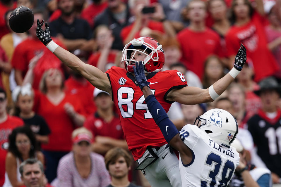 Georgia wide receiver Ladd McConkey (84) can't reach a pass as Samford defensive back Fred Flavors (38) defends during the first half of an NCAA college football game, Saturday, Sept. 10, 2022 in Athens, Ga. (AP Photo/John Bazemore)