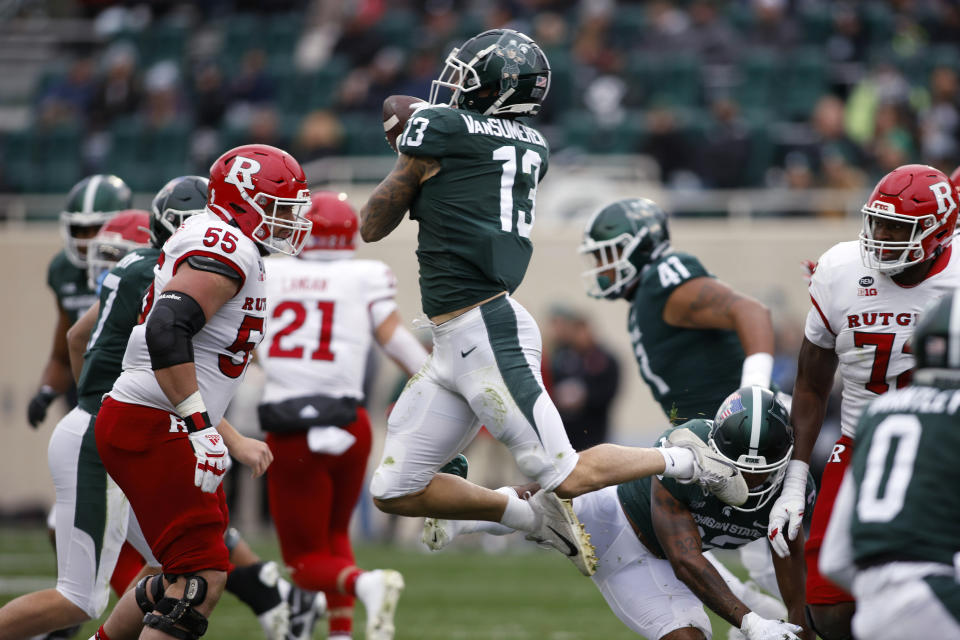 Michigan State's Ben VanSumeren (13) tries to intercept a Rutgers pass but can't hang on during the first half of an NCAA college football game, Saturday, Nov. 12, 2022, in East Lansing, Mich. (AP Photo/Al Goldis)