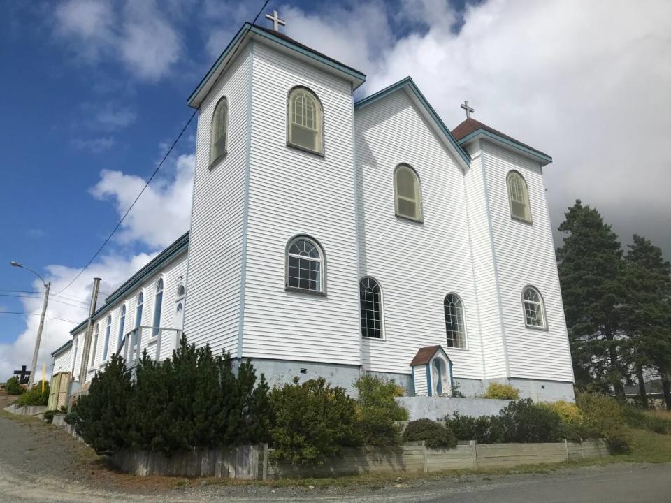 Our Lady of Mount Carmel Roman Catholic Church in Mount Carmel, St. Mary's Bay, has overlooked this community since 1883. But the church has been quiet for months, and is now for sale as the archdiocese sells off all its assets in a bid to raise money to compensate Mount Cashel abuse victims. (Terry Roberts/CBC - image credit)
