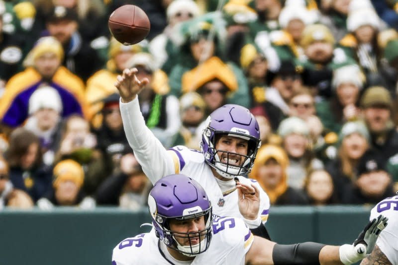 Former Minnesota Vikings quarterback Kirk Cousins (top) sustained a season-ending Achilles injury in October. File Photo by Tannen Maury/UPI