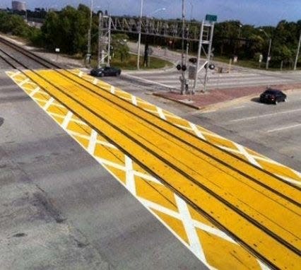 Brightline has added dynamic pavement markings at crossings to keep drivers from getting too close to railroad tracks. As drivers approach the critical zone, they are able to see the markings with X's and will not venture onto the zone.