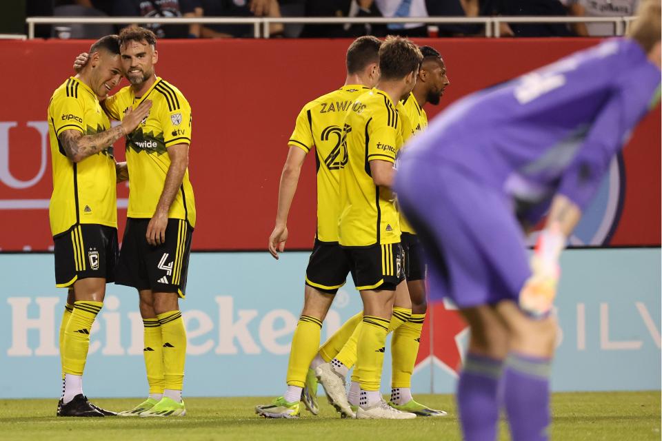 Crew forward Christian Ramirez (left) reacts after scoring a goal against Chicago on Saturday.