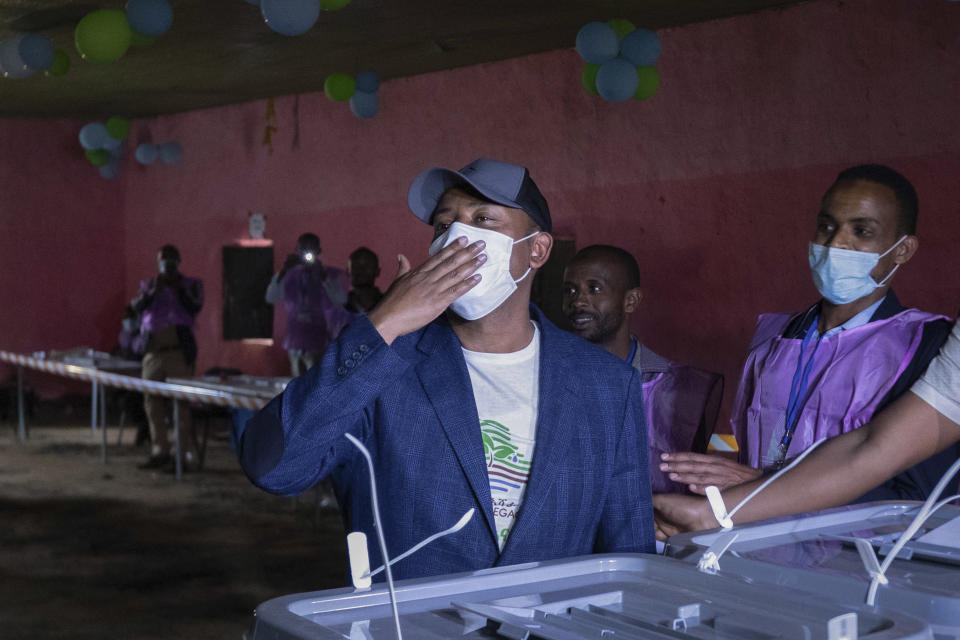 FILE - In this Monday, June 21, 2021 file photo, Ethiopia's Prime Minister Abiy Ahmed gestures to supporters after casting his vote in the general election, in his home town of Beshasha, in the Oromia region of Ethiopia. Ethiopia's ruling Prosperity Party was declared on Saturday, July 10, 2021 the winner of last month's national election in a landslide, assuring a second term for Prime Minister Abiy Ahmed. (AP Photo/Mulugeta Ayene, File)