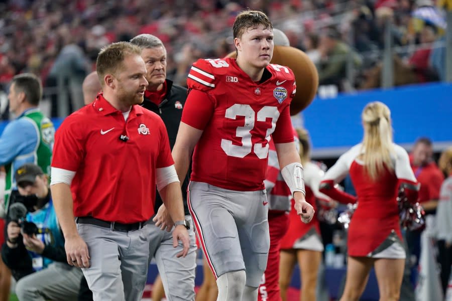 ARLINGTON, TEXAS – DECEMBER 29: Devin Brown #33 of the Ohio State Buckeyes reacts as he walks off the field with the training team after an injury during the first half against the Missouri Tigers in the Goodyear Cotton Bowl at AT&T Stadium on December 29, 2023 in Arlington, Texas. (Photo by Sam Hodde/Getty Images)