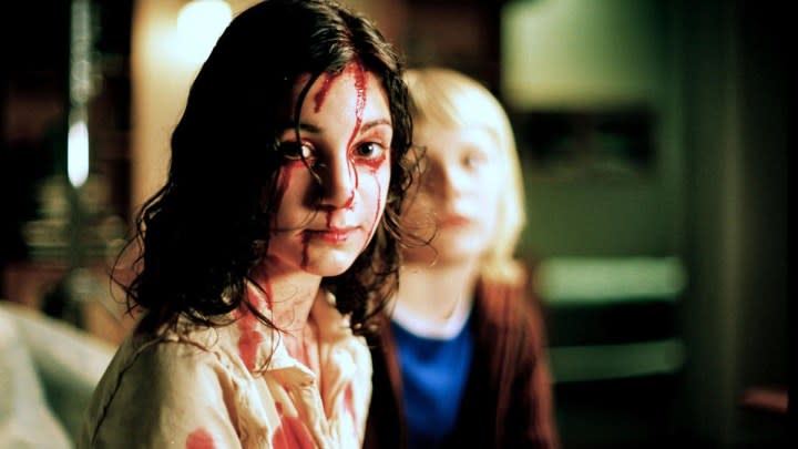 Lina Leandersson and Kåre Hedebrant in Let the Right One In.